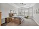 Spacious bedroom with large windows, neutral tones, and ample natural light at 5596 Cantucci St, Nokomis, FL 34275