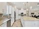 Beautiful kitchen featuring stainless steel appliances, stone countertops and island seating at 5596 Cantucci St, Nokomis, FL 34275