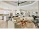 Open concept kitchen and living area with tile flooring, neutral paint, recessed lighting and modern decor at 5596 Cantucci St, Nokomis, FL 34275
