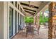 Charming outdoor seating area on a brick-paved patio, perfect for enjoying the beautiful landscaped surroundings at 5596 Cantucci St, Nokomis, FL 34275