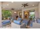 Relaxing patio with comfortable seating, a dining area, and access to the kitchen, perfect for indoor-outdoor living at 5596 Cantucci St, Nokomis, FL 34275