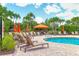 Community pool and lounge area, perfect for soaking up the sun in a relaxing and picturesque setting at 5596 Cantucci St, Nokomis, FL 34275
