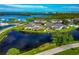 Community aerial view showcasing waterfront condos and lush green spaces at 719 Estuary Dr # 719, Bradenton, FL 34209