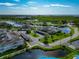 Aerial view of condos surrounded by lush landscaping and tranquil ponds at 719 Estuary Dr # 719, Bradenton, FL 34209