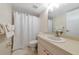 Cozy bathroom with shower and tub combination, single sink vanity, and neutral colored walls at 719 Estuary Dr # 719, Bradenton, FL 34209