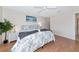 Bright bedroom features a ceiling fan, decorative bedding and a quaint, beachy atmosphere at 719 Estuary Dr # 719, Bradenton, FL 34209