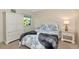 Bedroom with large closet and tropical bedding, offers a relaxing and inviting atmosphere at 719 Estuary Dr # 719, Bradenton, FL 34209