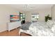 Bedroom featuring tropical bedding, TV, sliding glass doors leading to patio with neutral wall paint at 719 Estuary Dr # 719, Bradenton, FL 34209