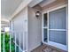 Inviting home entrance featuring a decorative light fixture and beautiful landscaping at 719 Estuary Dr # 719, Bradenton, FL 34209