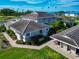 Aerial view of a home surrounded by tropical landscaping, shrubbery, and a stone walkway at 719 Estuary Dr # 719, Bradenton, FL 34209