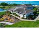Aerial view of a cozy home surrounded by vibrant landscaping with tropical plants and walkways at 719 Estuary Dr # 719, Bradenton, FL 34209