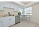 Bright eat in kitchen with white cabinets, stainless appliances and lots of natural light at 719 Estuary Dr # 719, Bradenton, FL 34209