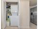 Convenient laundry closet features a stacked washer and dryer in the kitchen at 719 Estuary Dr # 719, Bradenton, FL 34209