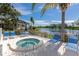 Relaxing hot tub by the water, with comfortable lounge chairs and a scenic view at 719 Estuary Dr # 719, Bradenton, FL 34209