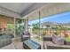 Enjoy outdoor living on this screened porch with comfortable seating and serene views at 719 Estuary Dr # 719, Bradenton, FL 34209