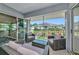 Relax on this screened porch with stylish outdoor furniture and views of the surrounding community at 719 Estuary Dr # 719, Bradenton, FL 34209