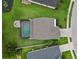 Expansive aerial view of home with a screened pool, patio, and lush green landscaping at 731 116Th Ne Ct, Bradenton, FL 34212