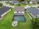 Beautiful backyard with a screened pool, patio, and well-manicured lawn at 731 116Th Ne Ct, Bradenton, FL 34212