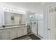 Bathroom featuring a glass enclosed shower, double sink vanity, and modern finishes at 731 116Th Ne Ct, Bradenton, FL 34212