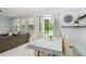Bright dining area with view of lanai and pool, and neutral decor at 731 116Th Ne Ct, Bradenton, FL 34212