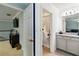 Hallway view into full bathroom with shower and vanity at 731 116Th Ne Ct, Bradenton, FL 34212