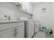 Well-equipped laundry room features modern appliances and ample storage at 731 116Th Ne Ct, Bradenton, FL 34212