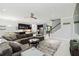 Spacious living room seamlessly connected to a modern kitchen and adjacent dining area at 731 116Th Ne Ct, Bradenton, FL 34212