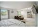Main bedroom with seating area, dresser, and a TV at 731 116Th Ne Ct, Bradenton, FL 34212