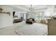 Spacious main bedroom with a seating area, vanity, and ample natural light from large windows at 731 116Th Ne Ct, Bradenton, FL 34212