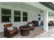 Covered patio with a round outdoor table and chairs on brick pavers, perfect for enjoying outdoor meals or morning coffee at 731 116Th Ne Ct, Bradenton, FL 34212