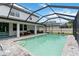 Large screened-in pool with brick paver deck, outdoor seating, and a spacious patio for Gathering gatherings and summer fun at 731 116Th Ne Ct, Bradenton, FL 34212