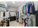 Spacious walk-in closet featuring custom shelving, clothing racks, and ample storage space for organizing wardrobes at 731 116Th Ne Ct, Bradenton, FL 34212
