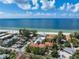 Breathtaking aerial view of the property with close beach access, community pool and ocean view at 7324 Gulf Dr # 12, Holmes Beach, FL 34217