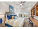 Bedroom with shutters, ceiling fan, and desk and chair at 7324 Gulf Dr # 12, Holmes Beach, FL 34217