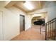 Well-lit garage and elevator entrance with tiled floors leading to a black SUV at 7324 Gulf Dr # 12, Holmes Beach, FL 34217