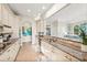 Bright kitchen with granite countertops, stainless steel appliances, and open view to living area at 7324 Gulf Dr # 12, Holmes Beach, FL 34217
