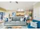 Living room with neutral decor, comfortable seating, open to wet bar and balcony access, and tile floors at 7324 Gulf Dr # 12, Holmes Beach, FL 34217