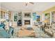 Inviting living room with fireplace, stylish furniture, and wet bar with lovely views of outdoor area at 7324 Gulf Dr # 12, Holmes Beach, FL 34217