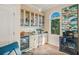 Close up of wet bar off the living room with refrigerator and view of outdoor area at 7324 Gulf Dr # 12, Holmes Beach, FL 34217