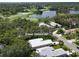 Expansive view of the community, golf course, pond, and homesites from above at 7904 Hampton Ct, University Park, FL 34201