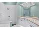 Bright bathroom features shower with a tiled floor and a large vanity at 7904 Hampton Ct, University Park, FL 34201