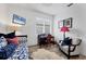 Bedroom features a daybed, desk, soft rug, and a comfortable striped chair at 7904 Hampton Ct, University Park, FL 34201