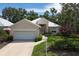Charming home featuring a well-maintained lawn, neutral exterior paint, and a large driveway at 7904 Hampton Ct, University Park, FL 34201