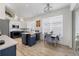 Bright kitchen with modern appliances, large island, and a dining area near a sunny window at 7904 Hampton Ct, University Park, FL 34201
