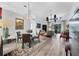 Bright and airy living room with a glass table, comfortable seating, fan and high ceilings at 7904 Hampton Ct, University Park, FL 34201