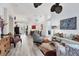 Large living area showcasing hardwood floors, stylish furniture, and decorative accents at 7904 Hampton Ct, University Park, FL 34201