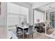 Sun room features a table and chairs with a view into a bright kitchen at 7904 Hampton Ct, University Park, FL 34201
