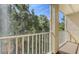 Private screened balcony with lush green scenery with a railing offering views of the surrounding foliage at 8823 White Sage Loop # 1802, Lakewood Ranch, FL 34202