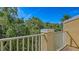 Private balcony offers a serene outdoor space with a view of the trees and lush landscaping at 8823 White Sage Loop # 1802, Lakewood Ranch, FL 34202