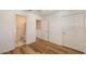 Bedroom featuring hardwood floors, and a doorway to the bathroom at 8823 White Sage Loop # 1802, Lakewood Ranch, FL 34202